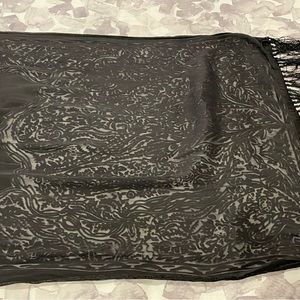Black fringed wrap with scrollwork design